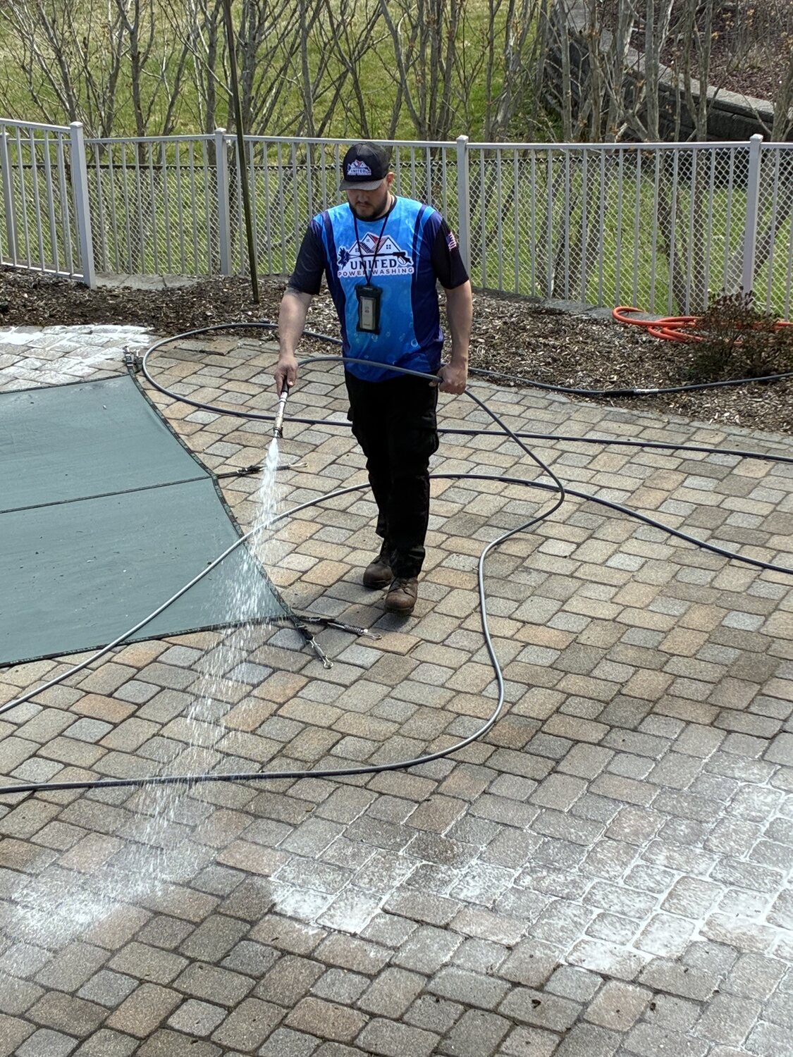 Cleaning pavers around a pool