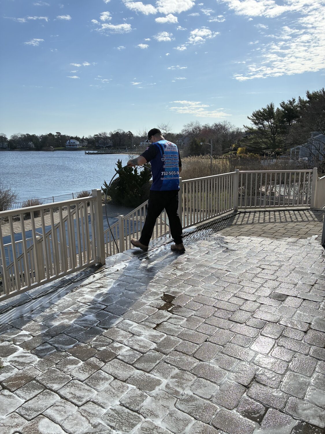 Soft-washing a waterfront paver patio